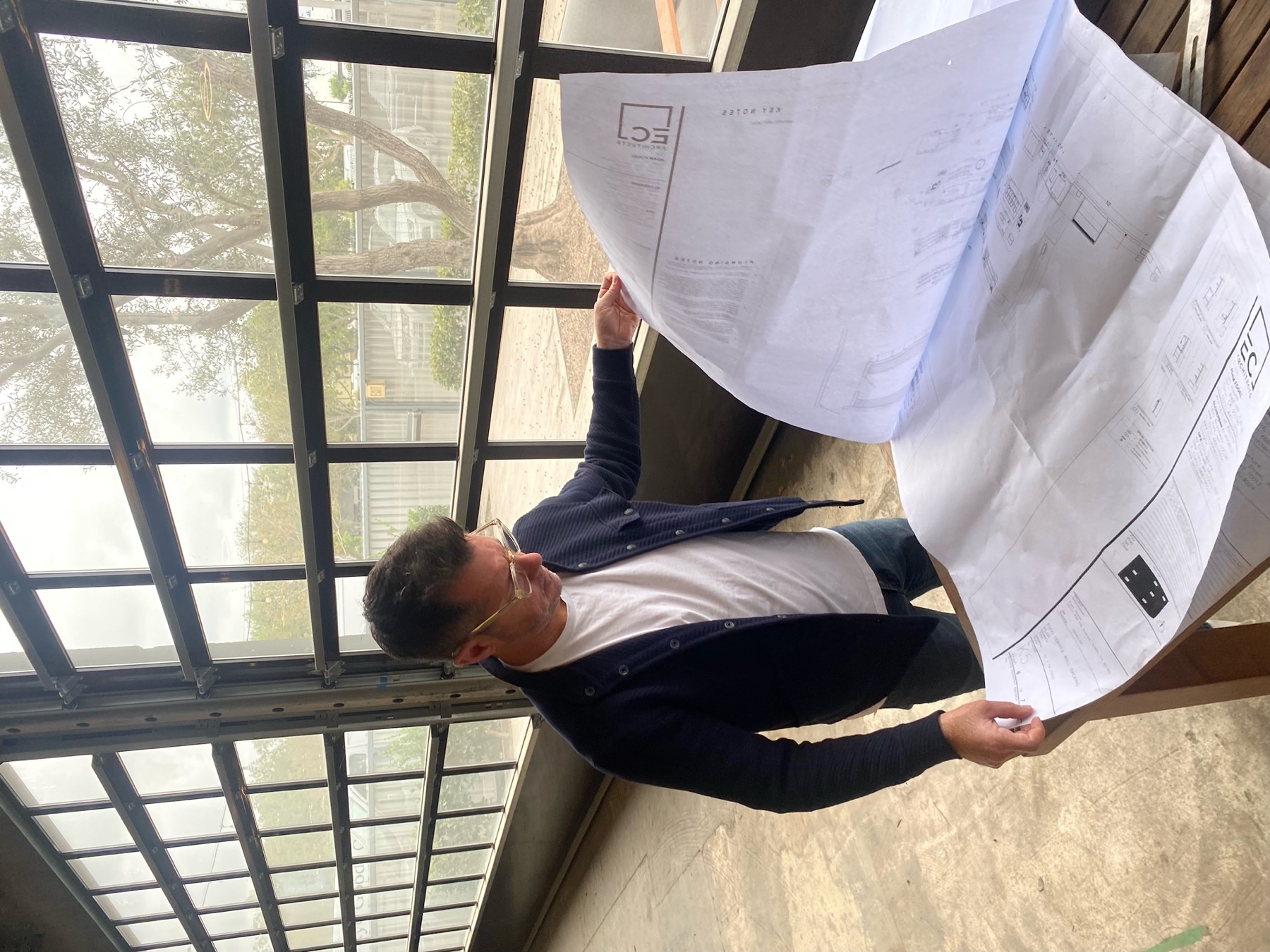 Zack Bates reviewing club renovation plans